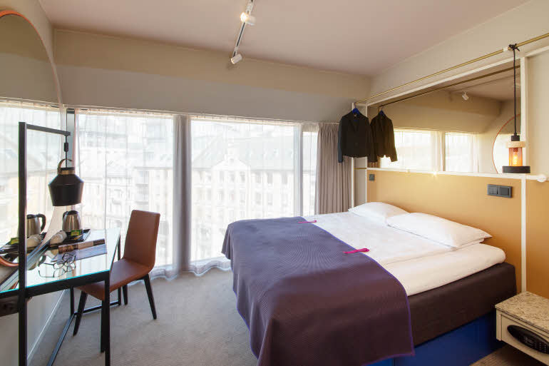 Bed and desk in room Superior
