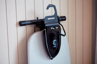 iron and iron board in room at scandic berlin potsdamer platz in germany