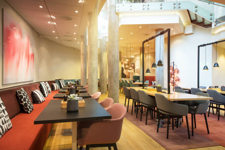 Tables and chairs in breakfast area