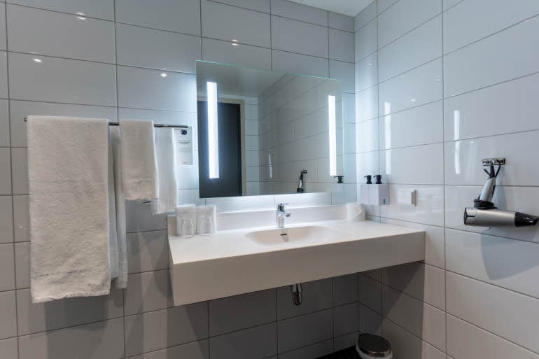 bathroom in room junior suite at scandic grand tromso in norway