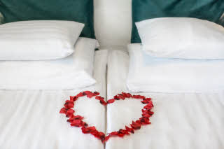 Heart of flower on bed