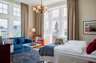 bed and sofa in family superior room at Scandic Stortorget