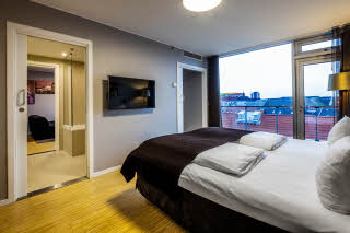 bed in master suite at scandic aarhus city