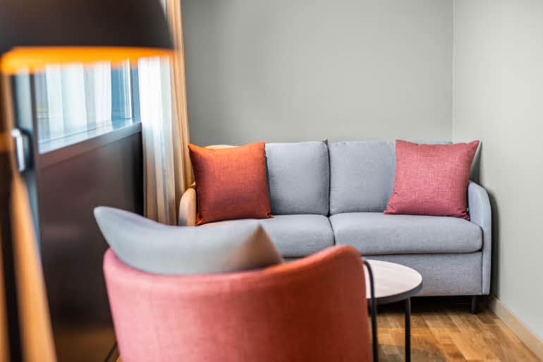 sofa area in junior suite at scandic sydhavnen