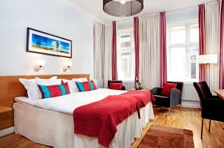 bed in superior room at Scandic Stortorget