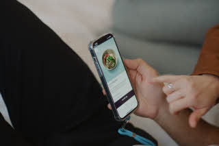hands with a mobile phone at scandic go
