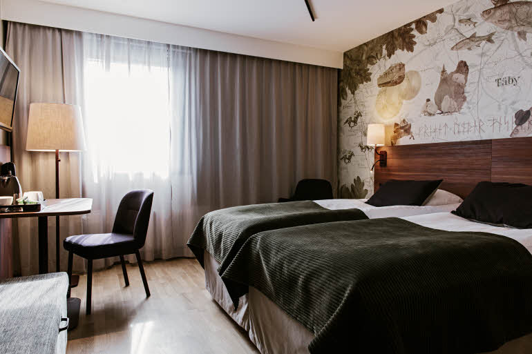 Beds and desk in Superior room Scandic Taby