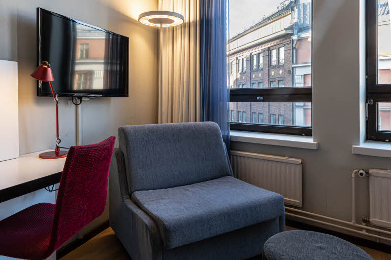 armchair in superior room at scandic kaisaniemi in helsinki