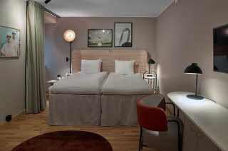 double bed in room family twin at Scandic Klara in Stockholm